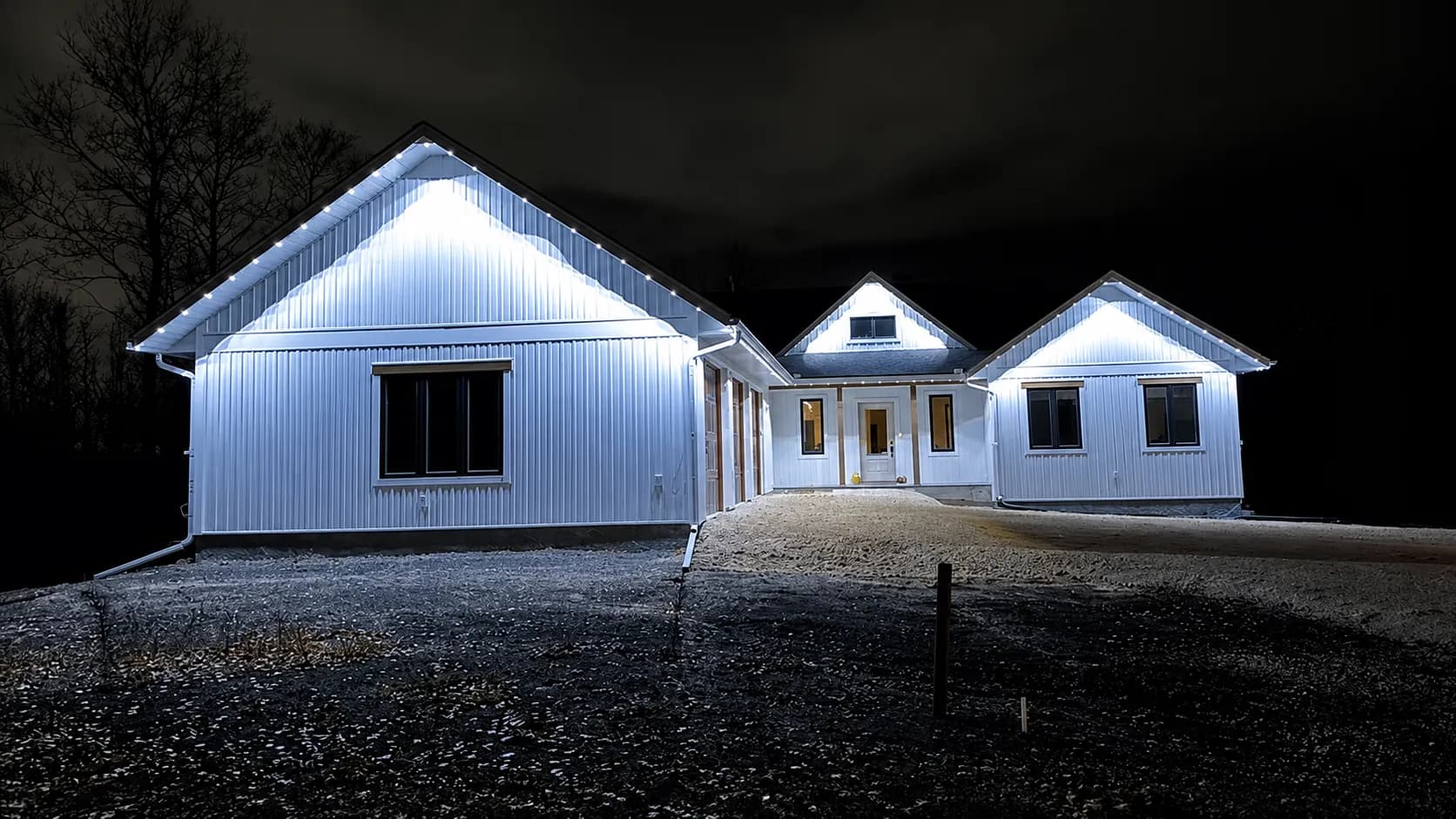 Holiday roofline lighting on a custom home in Manitoba
