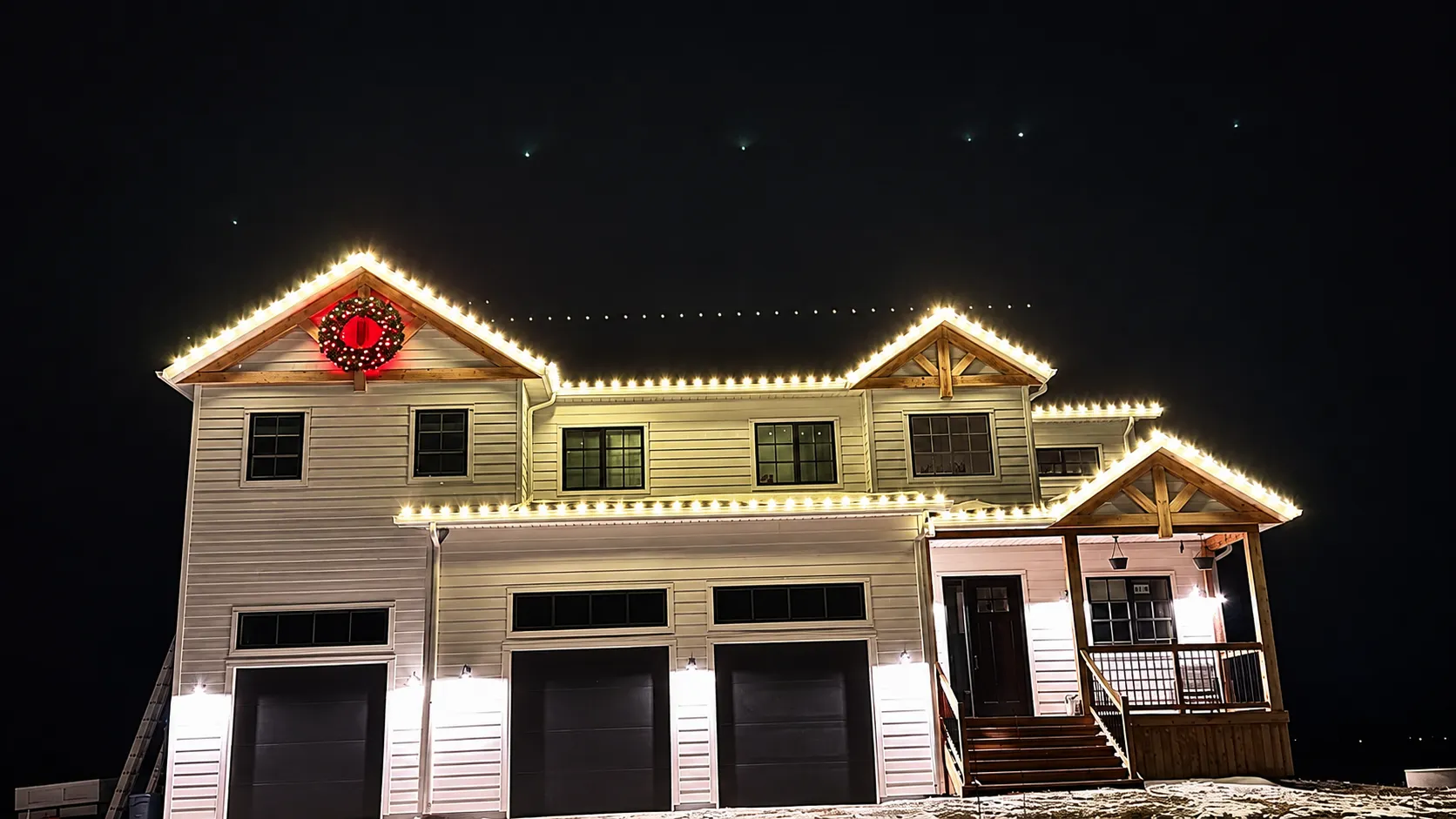 Spartan Builders warm white holiday roofline lighting