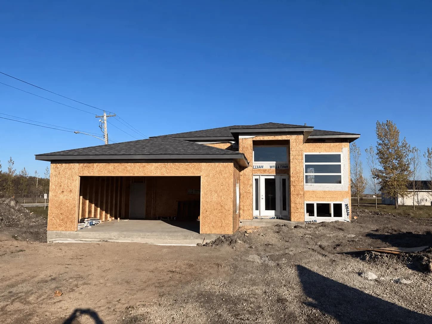 Spartan Builders Brick Custom Home Garage Exterior