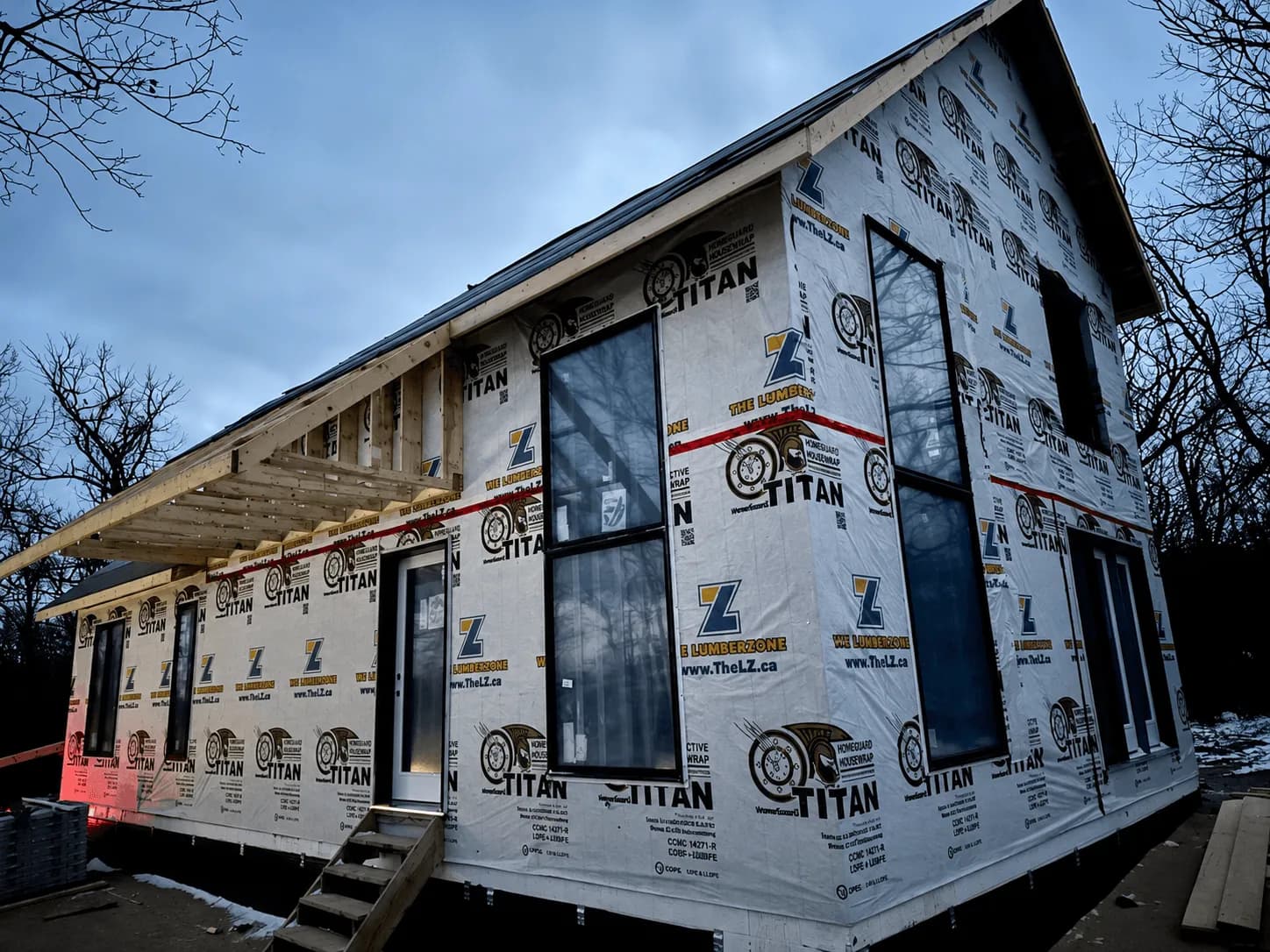 Spartan Builders Custom Home Housewrap Window Installation